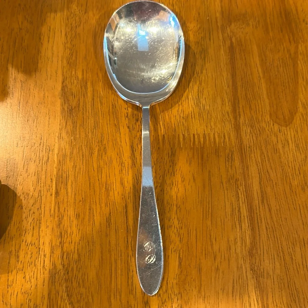 Reed & Barton silver plated serving spoon with “C” monogrammed on the handle.